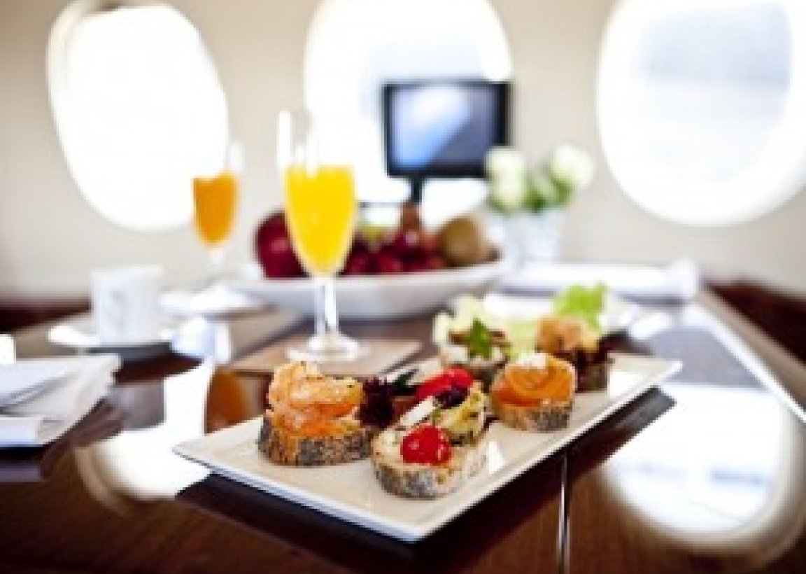 Table with food inside a Charter Jet